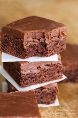 Three stacked chocolate brownies