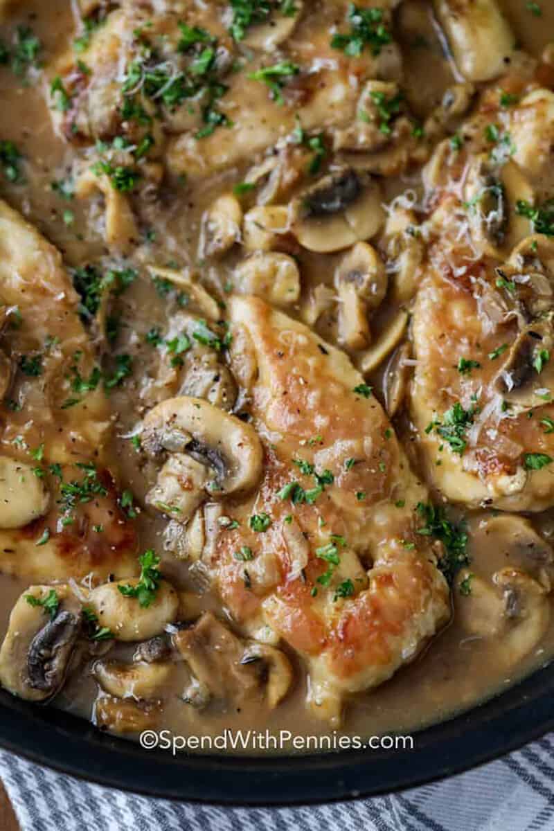 This easy Chicken Marsala recipe is simple to make but has gourmet appeal. Olive garden has nothing on this delicious recipe. Tender chicken fillets are simmered in a mushroom wine sauce until savory and fragrant. Make a cream version with half and half instead of chicken broth, or stick to the recipe for the best Chicken Marsala ever. #chickenmarsala #recipe #homemade #spendwithpennies Easy Chicken Marsala in creamy sauce