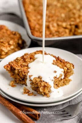A serving of brown sugar baked oatmeal being drizzled with cream