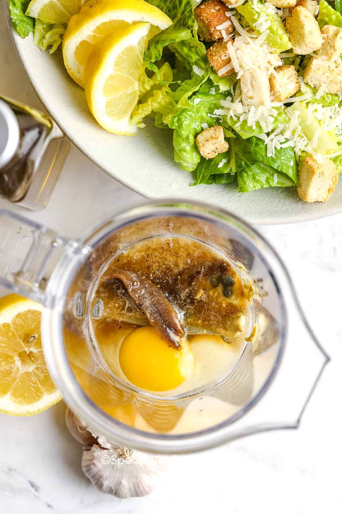 caesar salad dressing ingredients in a blender