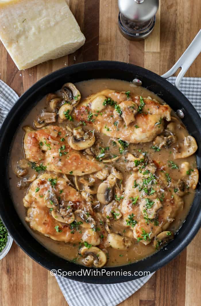 Tender and juicy chicken is featured in this easy chicken marsala recipe. Everyone loves this savory, saucy dish. Try it served over rice, or have it with thick slices of French bread. It's always a favorite entree, every time it's served. #chickenmarsala #recipe #homemade #spendwithpennies Chicken Marsala in a pan