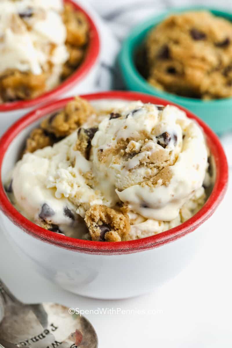 a bowl of  homemade cookie dough ice cream with cookie dough in the background
