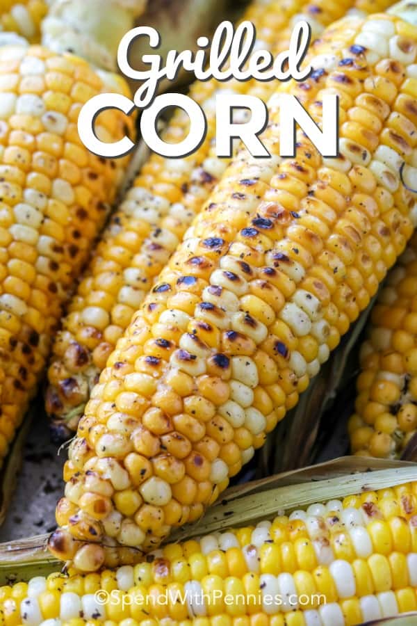 Grilled Corn in husks shown with a title