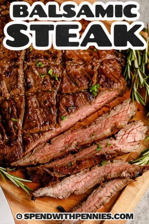 Balsamic Marinated Flank Steak cut into slices with writing